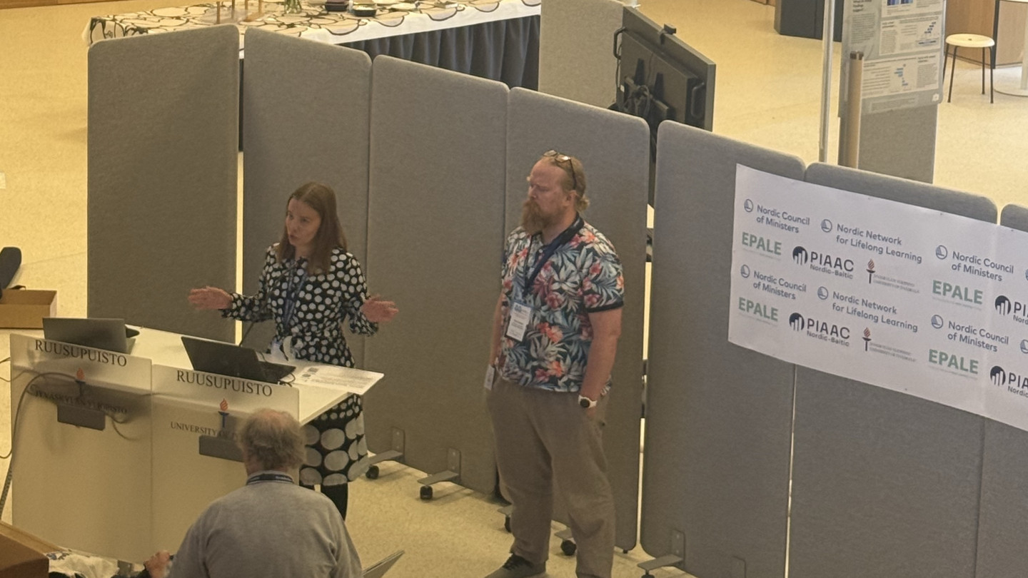 Two researchers presenting their project and findings