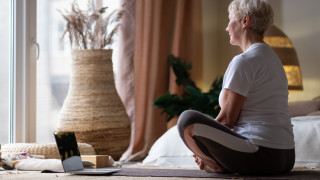 Woman sitting on a yoga mat