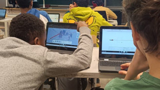 Teacher explaining a phenomena in a large screen