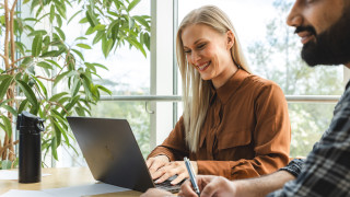 A woman studying on a computer.