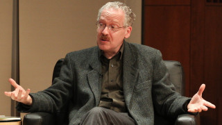 Lawrence M. Principe speaking, gesturing with both hands.