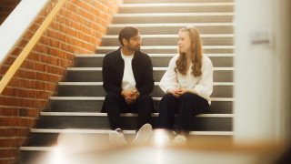 Students sitting at JYU Main Building stairs
