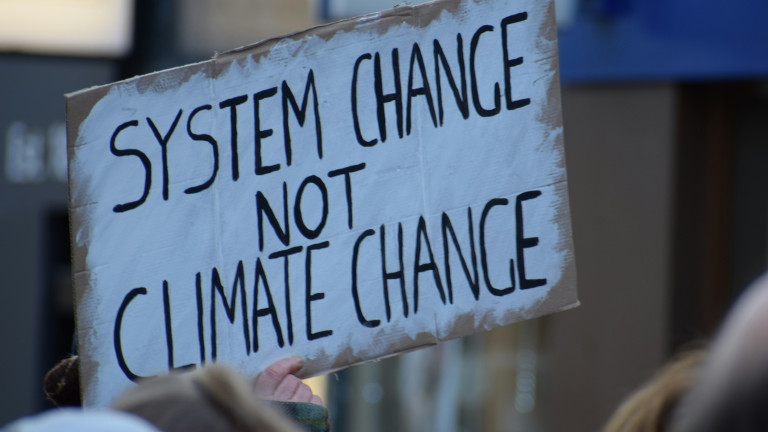 Plaque with the text &quot;System change not climate change&quot;
