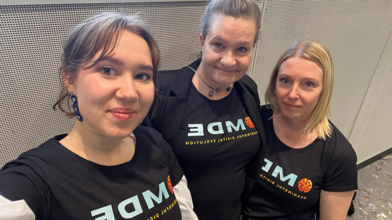 Three women taking a selfie. 