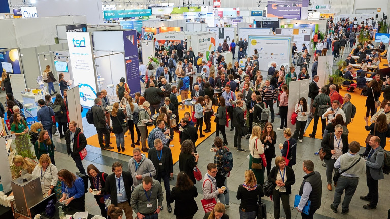 A room full of people at a conference.