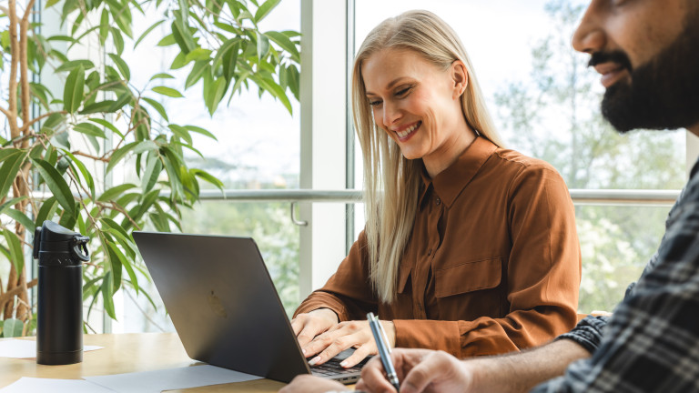 A woman studying on a computer.